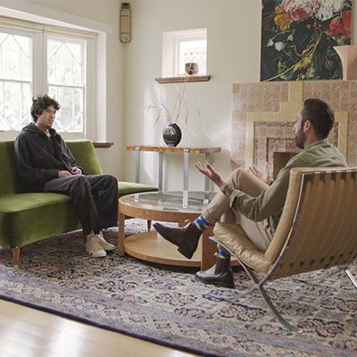 Photo of man listening with great interest to his therapist in an office.